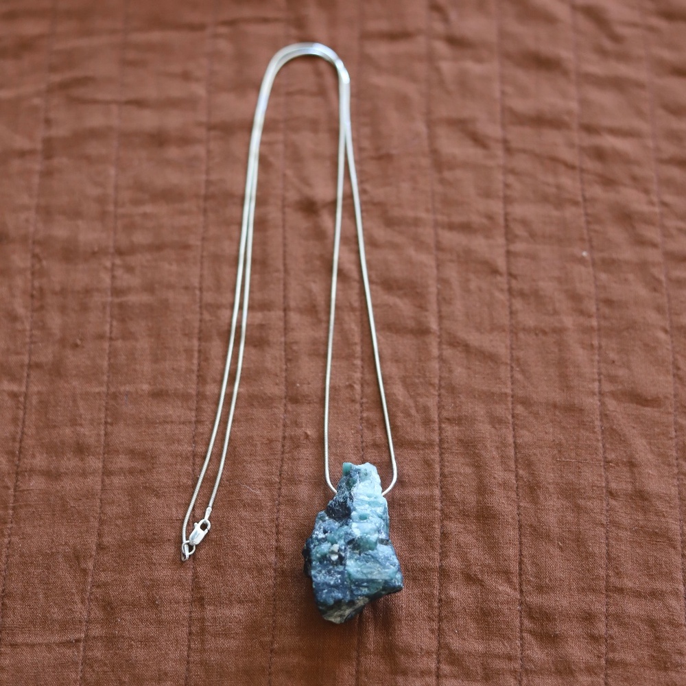 Raw emerald and mica semi precious stone/rock on long silver chain. NWT